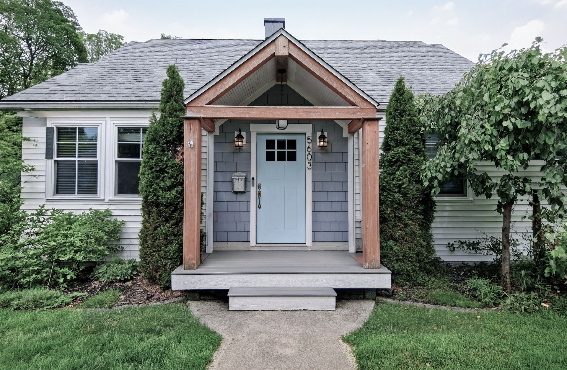 A tidy front porch before styling — bare entry, undecorated door